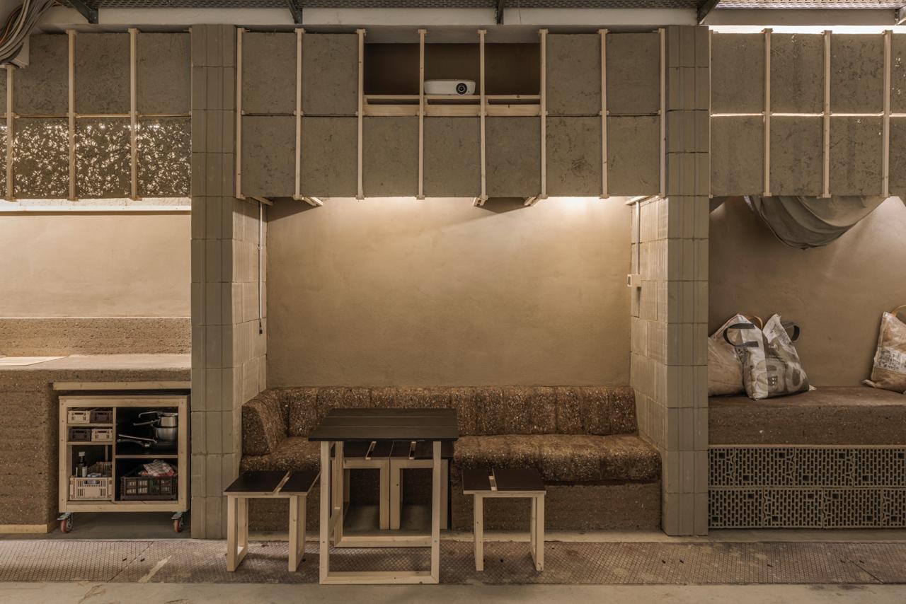 The bench, counter and shelving seen along the wall